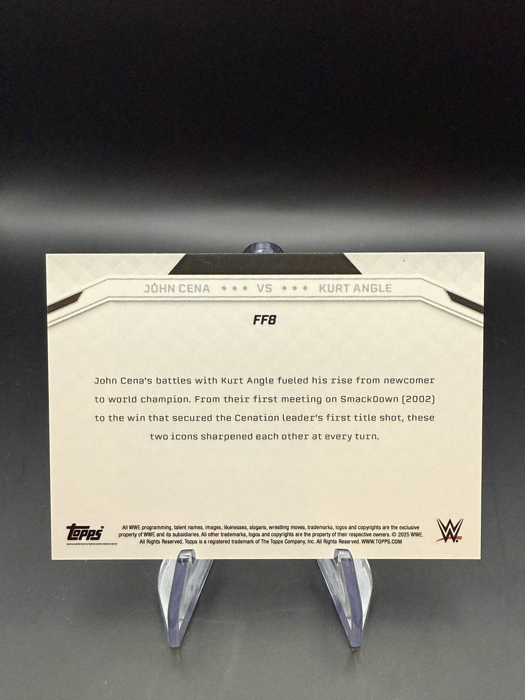 John Cena / Kurt Angle 2025 WWE Topps John Cena Commemorative Collection Famed Foes Green Camo Foil /35